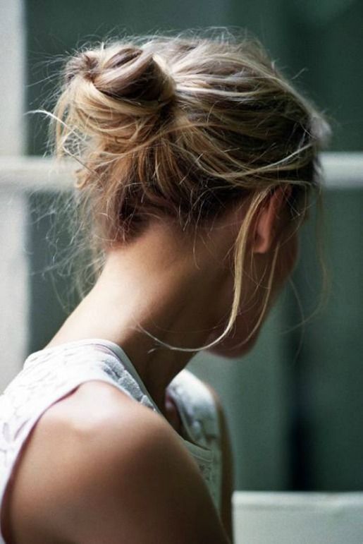 a messy low bun with a lot of textured hair and some locks down is a cool hairstyle to rock, it's veyr comfy in wearing
