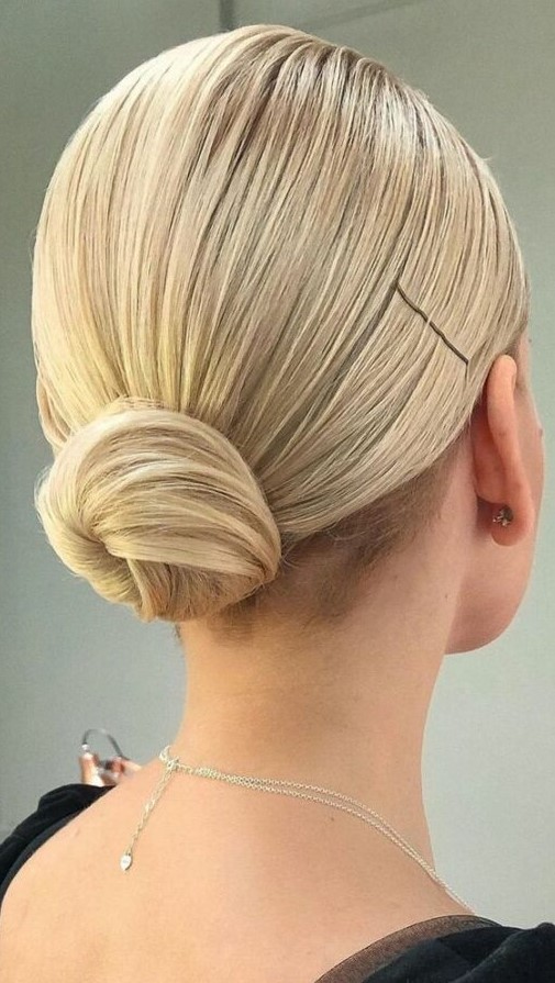 a slick low bun with a perfectly sleek top is a great idea of an office hairstyle or when you wanna look a bit more formal