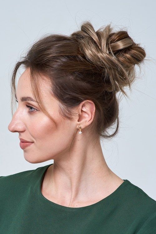 a messy top knot with twists, with a bump and some hair down can work with medium and long hair