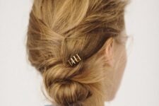 14 a super messy and textured twisted low bun is a fast solution to make on the go