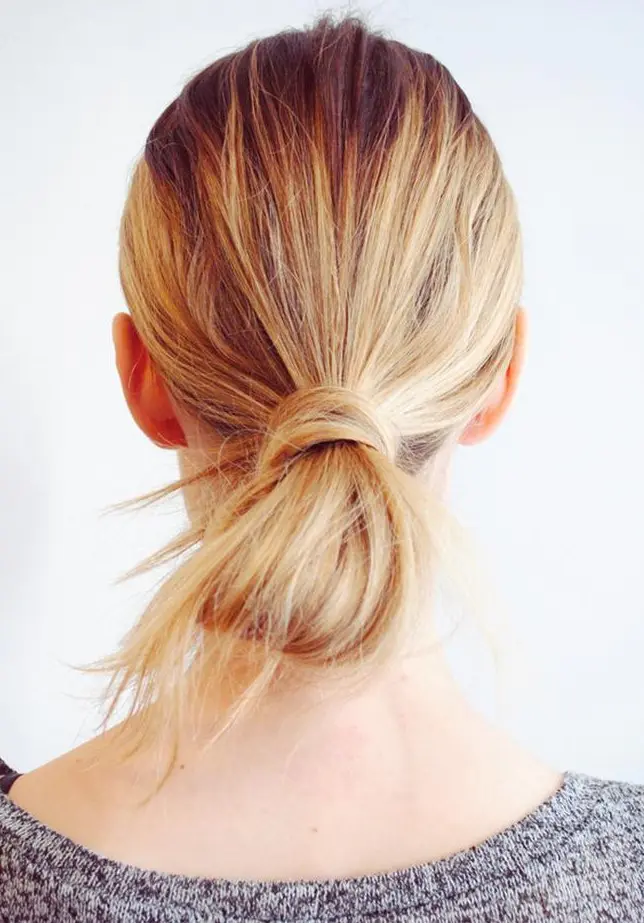 a wrapped low bun is a cool take on a usual low bun, use part of your hair to wrap around