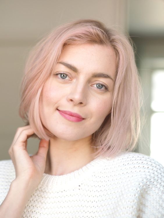 a romantic blush blunt bob with a darker root, side part and texture is a cool and delicate idea
