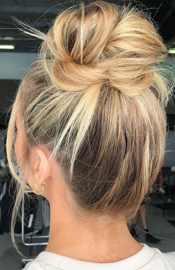 a very messy top knot on long hair, with some textured hair down is always a good idea to try