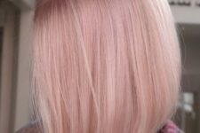 16 a shiny light pink bob with central parting and straight hair is fantastic for anyone who loves such shades