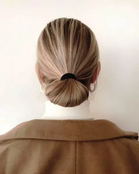such a sleek low bun made of a low ponytail, with a sleek top is a great and fast idea for a bad hair day