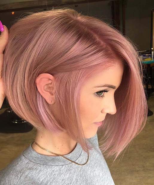 a stylish strawberry pink chin-length bob with a lot of volume and side parting is a catchy and bold idea
