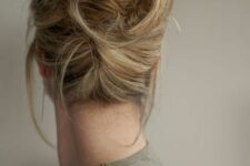 23 a messy twisted updo with some locks down, face-framing hair is a cool and lovely idea