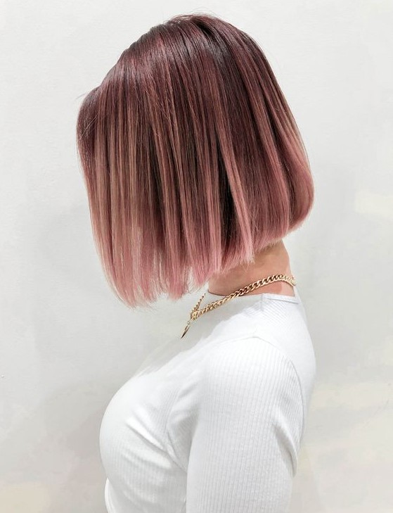 a short chestnut bob with a darker root and pastel pink balayage is a fresh and cool idea to rock a trendy shade