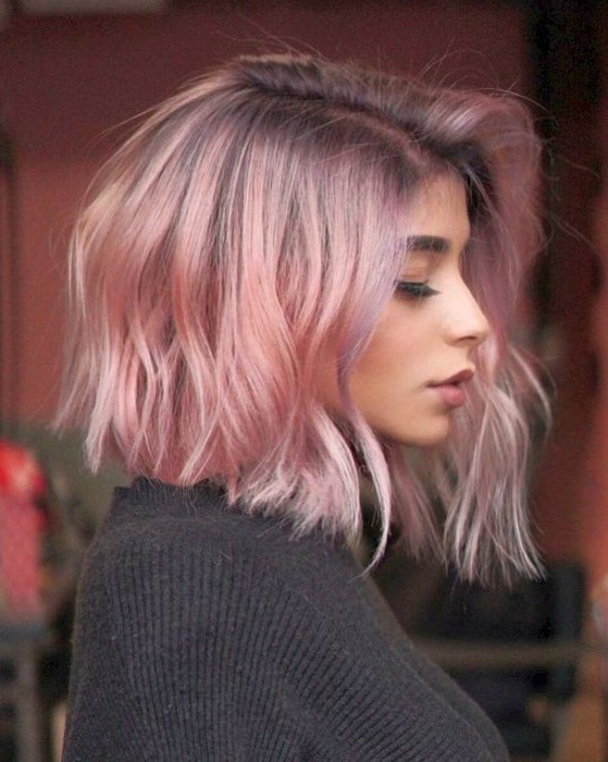 a short wavy bob with a dark purple root and pastel pink hair is a lovely idea if you wanna rock a classic haircut