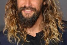 Jason Momoa rocking classic surfer hair, long waves with a darker root and blonde ombre looks amazing