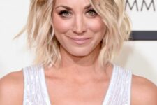 Kaley Cuoco wearing a cool brunette to icy blonde wavy bob looks adorable and very chic
