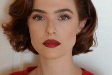 Zoey Deutsch wearing a retro-inspired ginger wavy chin-length bob with side part looks fabulous and very chic