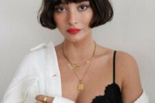 a French blunt bob in dark brown, with waves and bans is a catchy idea with real French chic