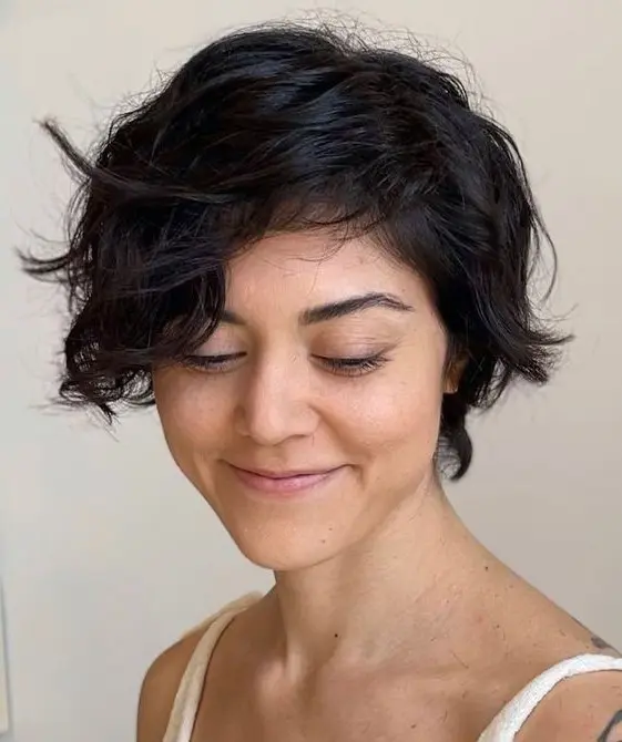 a bixie haircut on black wavy hair and textured ends is a cool idea, and your natural waves create a volume