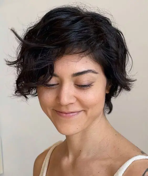 a bixie haircut on black wavy hair and textured ends is a cool idea, and your natural waves create a volume