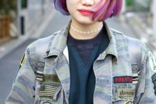 a black chin-length bob with purple dip-dyed hair and bangs is a catchy idea inspired by the latest hair coloring trends