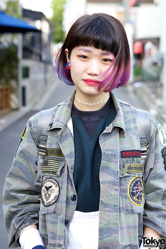 a black chin-length bob with purple dip-dyed hair and bangs is a catchy idea inspired by the latest hair coloring trends