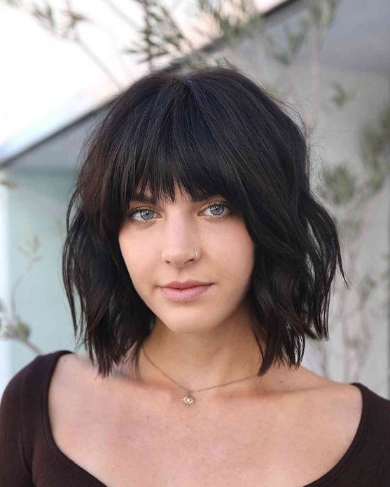 a black choppy bob with bangs and waves is a lovely idea to rock and it looks fresh, bold and rebellious