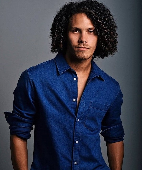 a black curly man bob is stylish, complete your look with a short beard and define your curls with a moisturizer