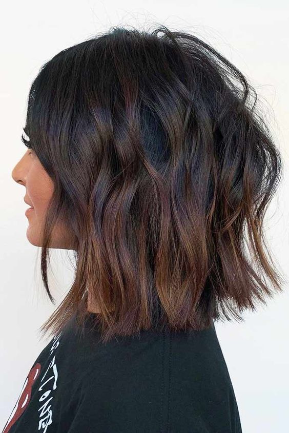 a black long wavy bob with auburn ombre that doesn't look too bold but creates an interesting look