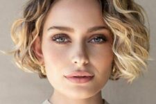 a blonde balayage bob with a darker root and waves is a chic and catchy idea for every girl