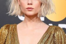 a blonde blunt bob with middle part, textural waves and a lot of volume looks wow