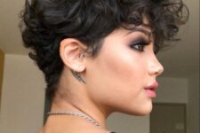 a bold black wavy pixie with a lot of volume and longer bangs is a very beautiful and eye-catching idea to try