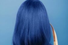 a bold blue to navy straight long bob is a fresh take on a classic cut, a twist made with bold color