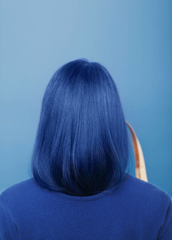 a bold blue to navy straight long bob is a fresh take on a classic cut, a twist made with bold color