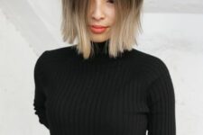 a bold ombre bob with a black top and cold ashy blonde ombre with a bit of volume is a catchy and bright idea