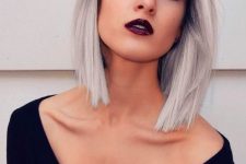 a bold straight long bob with black to silver blonde is contrasting and jaw-dropping