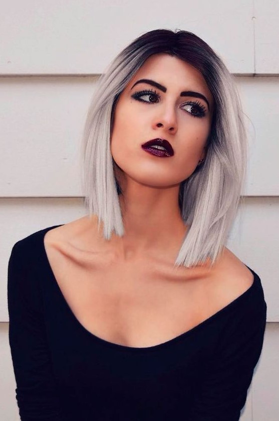 A bold straight long bob with black to silver blonde is contrasting and jaw dropping
