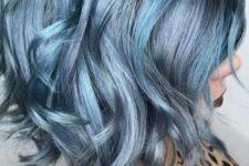 a bold wavy bob in various metallic shades of blue is a super catchy idea that will make a statement