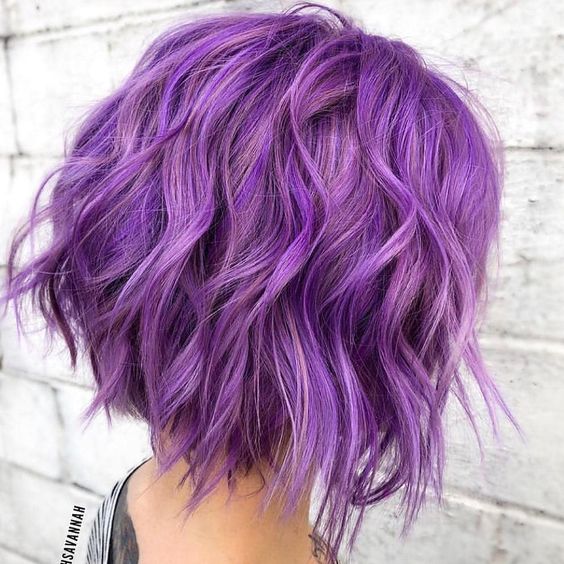 a bright and catchy purple wavy long bob with a lot of volume and texture is a stylish and bright idea to try
