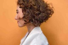 a chin-length curly inverted bob keeps maintenance minimal for curled hair, highlights would be great for more texture
