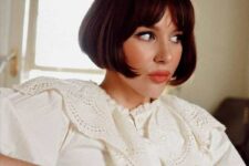 a classy dark brown jaw-skimming length French bob with curtain bangs is iconic and it will turn heads