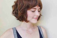 a cute ginger French bob with bottleneck bangs is a playful and lovely idea, it looks soft and cute