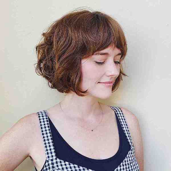 a cute ginger French bob with bottleneck bangs is a playful and lovely idea, it looks soft and cute
