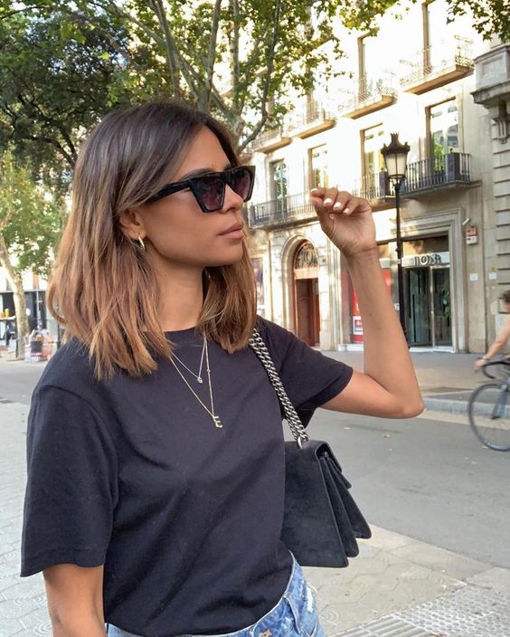 a dark brown outgrown bob with caramel ombre and texture, with central part, is a cool idea for summer