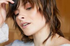 a dark brown wolf haircut with caramel balayage, with layers and bangs is a lovely idea for fine hair