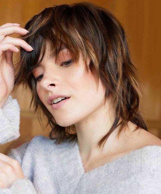 a dark brown wolf haircut with caramel balayage, with layers and bangs is a lovely idea for fine hair