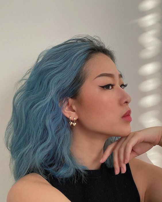 a fantastic ocean blue wavy long bob with a darker root will make a bold statement for sure