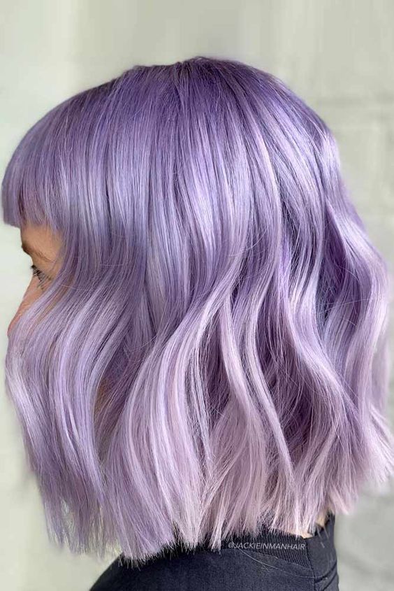 a gorgeous lilac wavy long bob with bangs and a slight ombre effect is a fantastic idea with a delicate feel, perfect for spring and summer