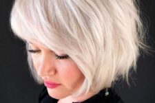 a gorgeous platinum blonde feathered bob with side bangs is a chic and beautiful idea that makes a statement with color