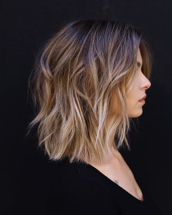 a layered long bob with a darker root and blonde highlights, with textured waves, is a gorgeous solution