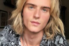 a long and wavy blonde bob with side part and waves plus some texture is a stylish idea for a modern guy