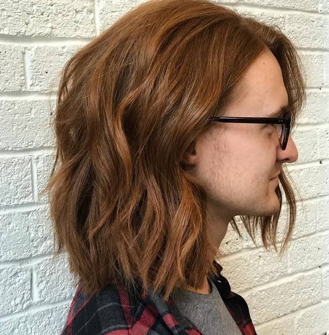 a long ginger bob with a bit of waves and a middle part is a stylish and catchy idea for any guy