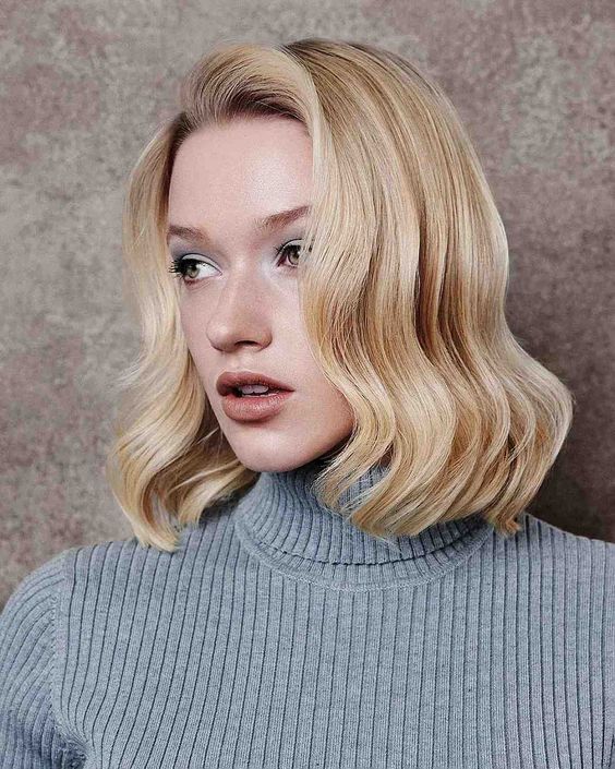 A long gold blonde bob with a bit of retro waves is a chic and classy idea for a retro inspired look