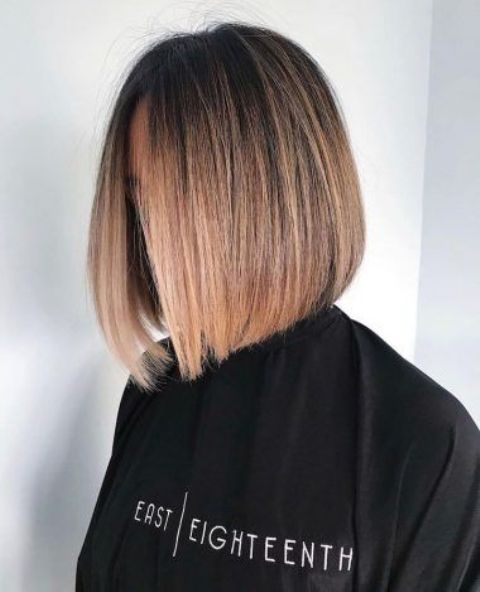a lovely and chic dark brunette sleek bob with caramel ombre and central part looks amazing