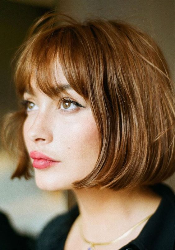 a lovely caramel and honey French bob with bangs is a super chic and timeless solution that always works